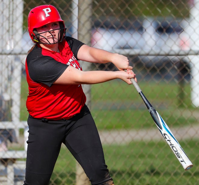 Polytech's Julia MacConnell watches her three-run home run head over the right field fence in the fourth inning of Polytech's 8-3 win at Smyrna High School, Thursday, April 18, 2024.