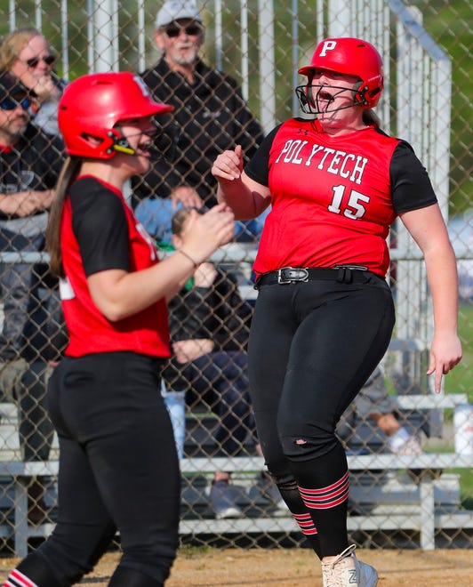 Polytech's Rachel Carey yells as she scores on Julia MacConnell's three-run home run in the fourth inning of Polytech's 8-3 win at Smyrna High School, Thursday, April 18, 2024.