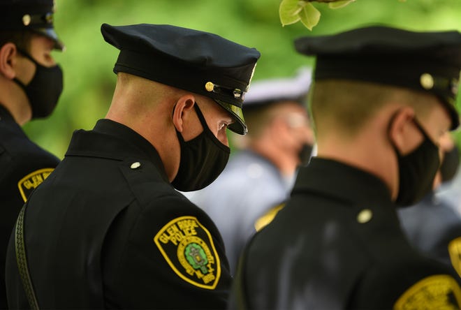 Officers pay their respects outside of the Glen Ridge Municipal Complex during a memorial service in Glen Ridge on 05/14/20.