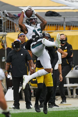 Eagles receiver Travis Fulgham makes a catch with on Steelers cornerback Steven Nelson Sunday.