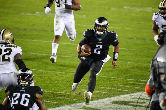 Eagles' Jalen Hurts (2) carries the ball against the Saints Sunday, Dec. 13, 2020 in Philadelphia.