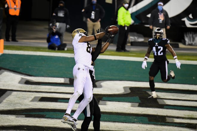 Saints' Jared Cook (87) catches a touchdown pass against the Eagles Sunday, Dec. 13, 2020 in Philadelphia. The Eagles won 24-21.