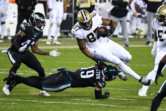 Saints' Jared Cook (87) makes a reception against the Eagles Sunday, Dec. 13, 2020 in Philadelphia. The Eagles won 24-21.