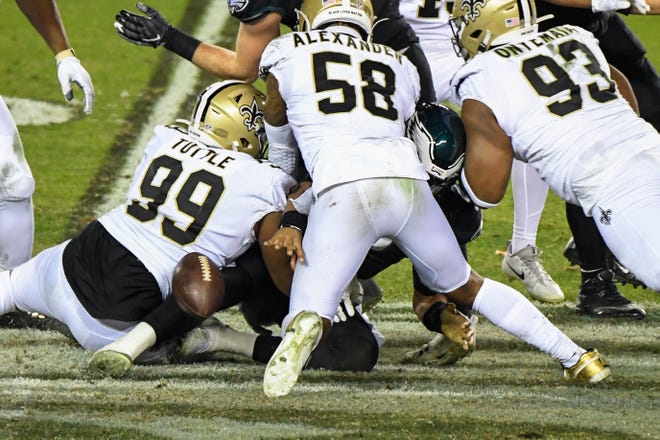 Eagles' Jalen Hurts (2) fumbles the ball for a turnover against the Saints Sunday, Dec. 13, 2020 in Philadelphia. The Eagles won 24-21.