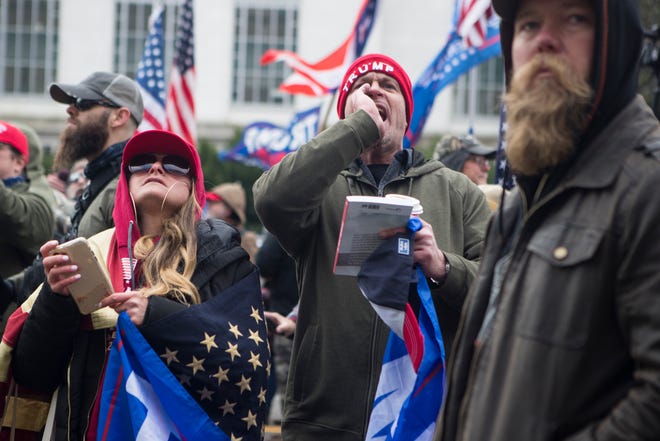 Jan 6, 2021; Washington, DC, USA; Trump supporters protest outside the Department of Justice Wednesday afternoon as lawmakers inside debated the certification of the presidential election.  Mandatory Credit: Jerry Habraken-USA TODAY