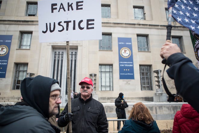 Jan 6, 2021; Washington, DC, USA; Trump supporters protest outside the Department of Justice Wednesday afternoon as lawmakers inside debated the certification of the presidential election.  Mandatory Credit: Jerry Habraken-USA TODAY