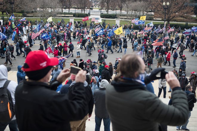 Jan 6, 2021; Washington, DC, USA; Trump supporters march towards the U.S. Capitol Wednesday afternoon as lawmakers inside debated the certification of the presidential election.  Mandatory Credit: Jerry Habraken-USA TODAY